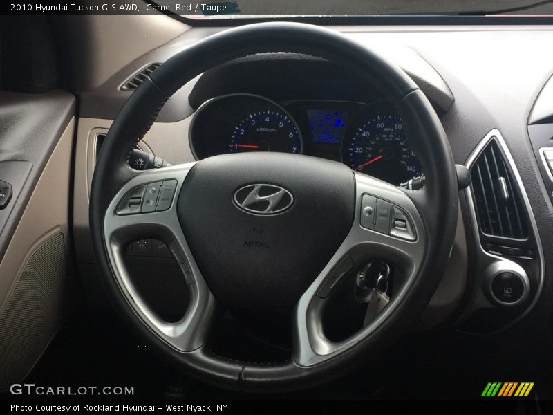 Garnet Red / Taupe 2010 Hyundai Tucson GLS AWD