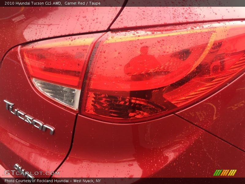 Garnet Red / Taupe 2010 Hyundai Tucson GLS AWD
