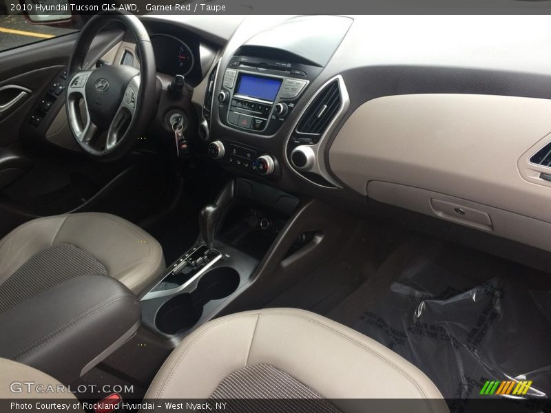 Garnet Red / Taupe 2010 Hyundai Tucson GLS AWD
