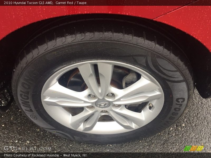 Garnet Red / Taupe 2010 Hyundai Tucson GLS AWD