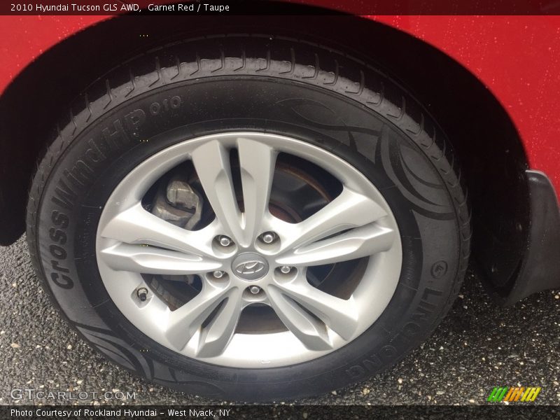 Garnet Red / Taupe 2010 Hyundai Tucson GLS AWD