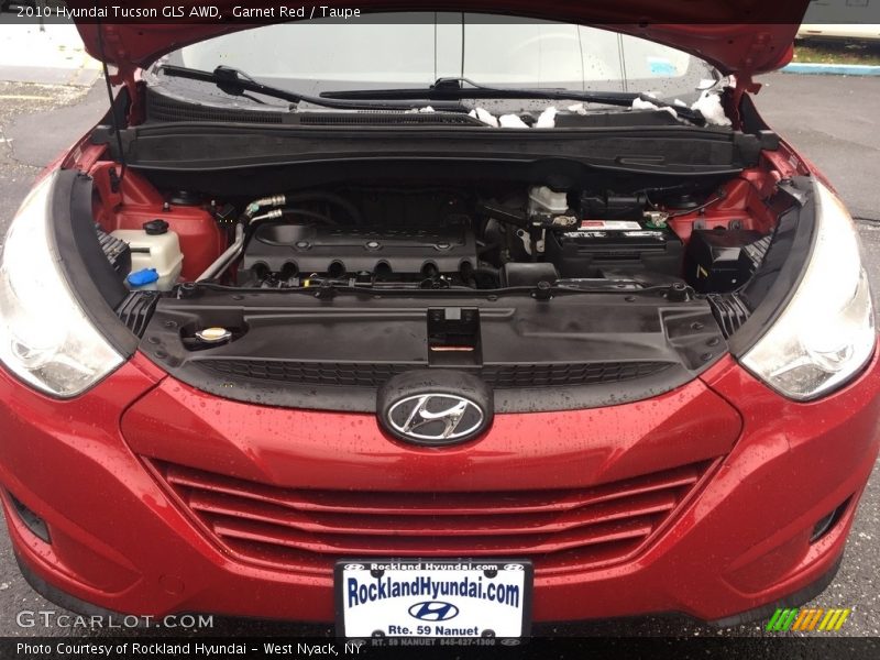 Garnet Red / Taupe 2010 Hyundai Tucson GLS AWD