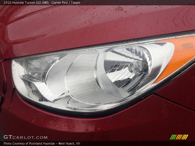 Garnet Red / Taupe 2010 Hyundai Tucson GLS AWD