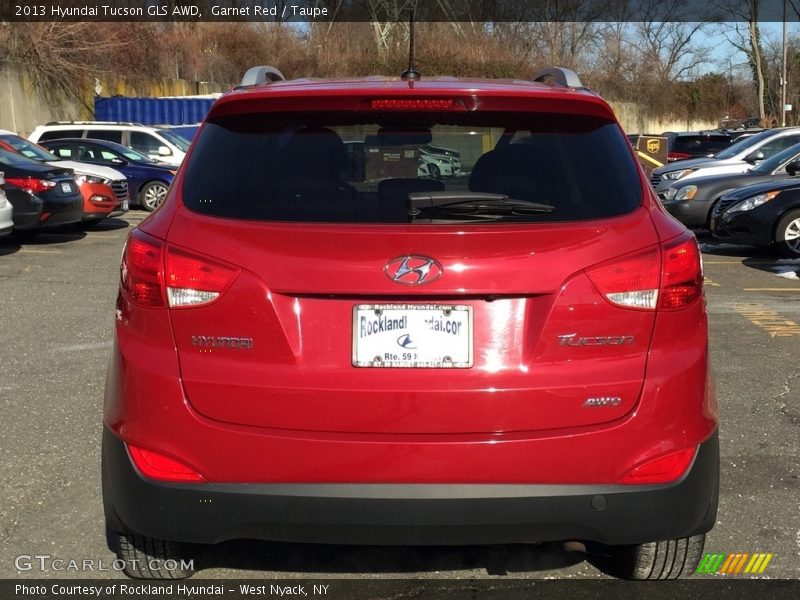 Garnet Red / Taupe 2013 Hyundai Tucson GLS AWD