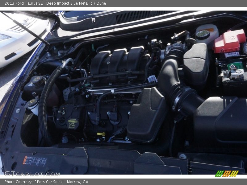 Deep Impact Blue Metallic / Dune 2013 Ford Taurus SE