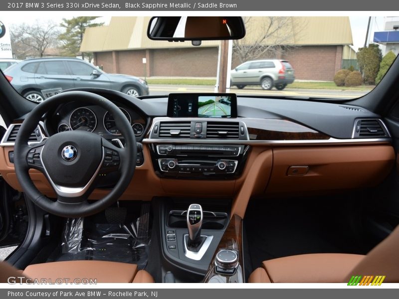 Black Sapphire Metallic / Saddle Brown 2017 BMW 3 Series 330i xDrive Sedan