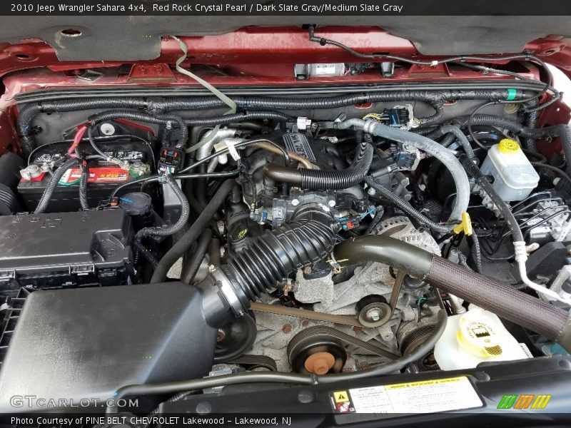 Red Rock Crystal Pearl / Dark Slate Gray/Medium Slate Gray 2010 Jeep Wrangler Sahara 4x4