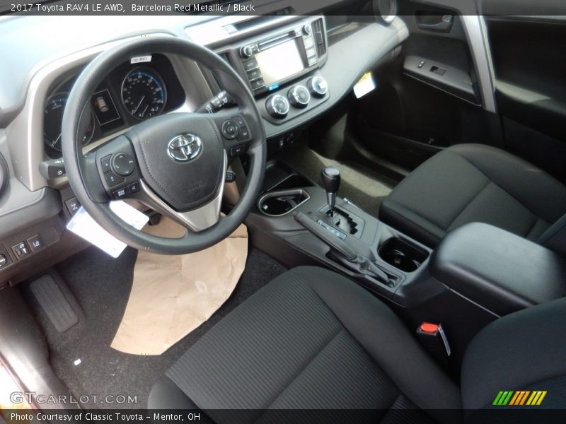 Barcelona Red Metallic / Black 2017 Toyota RAV4 LE AWD