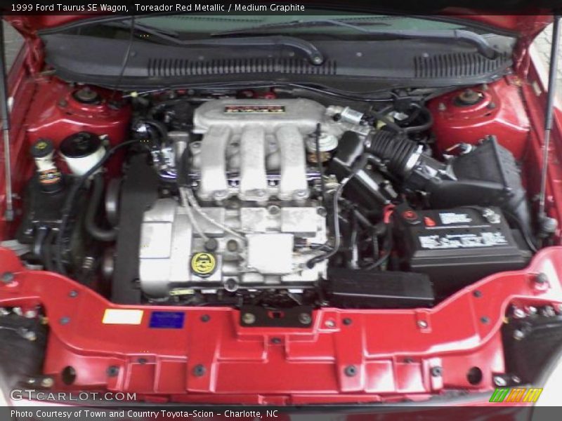 Toreador Red Metallic / Medium Graphite 1999 Ford Taurus SE Wagon