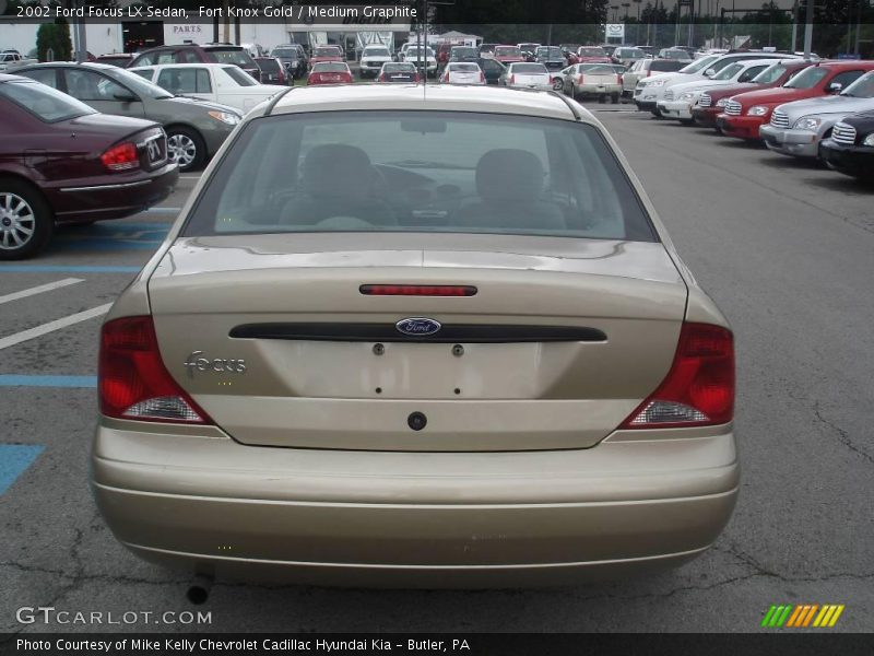 Fort Knox Gold / Medium Graphite 2002 Ford Focus LX Sedan