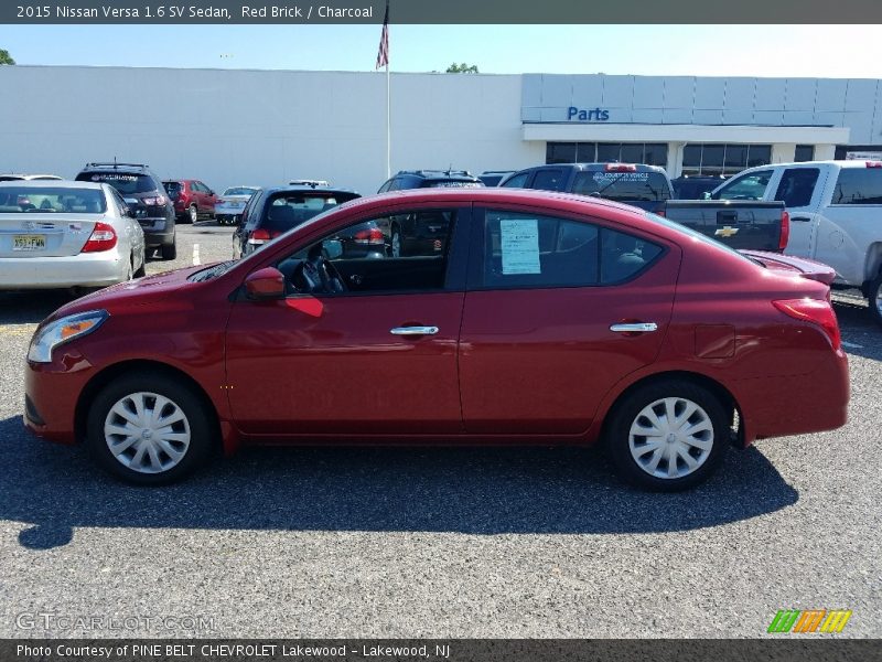 Red Brick / Charcoal 2015 Nissan Versa 1.6 SV Sedan