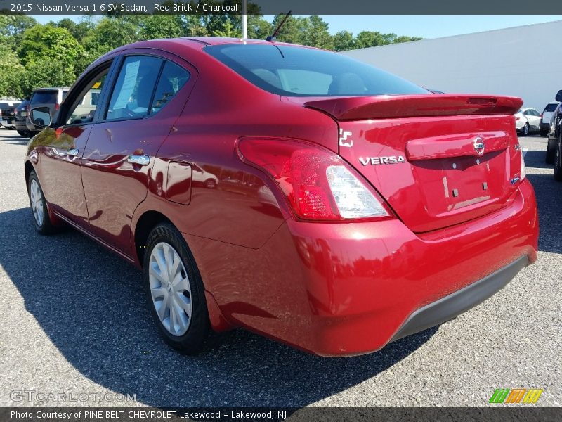 Red Brick / Charcoal 2015 Nissan Versa 1.6 SV Sedan