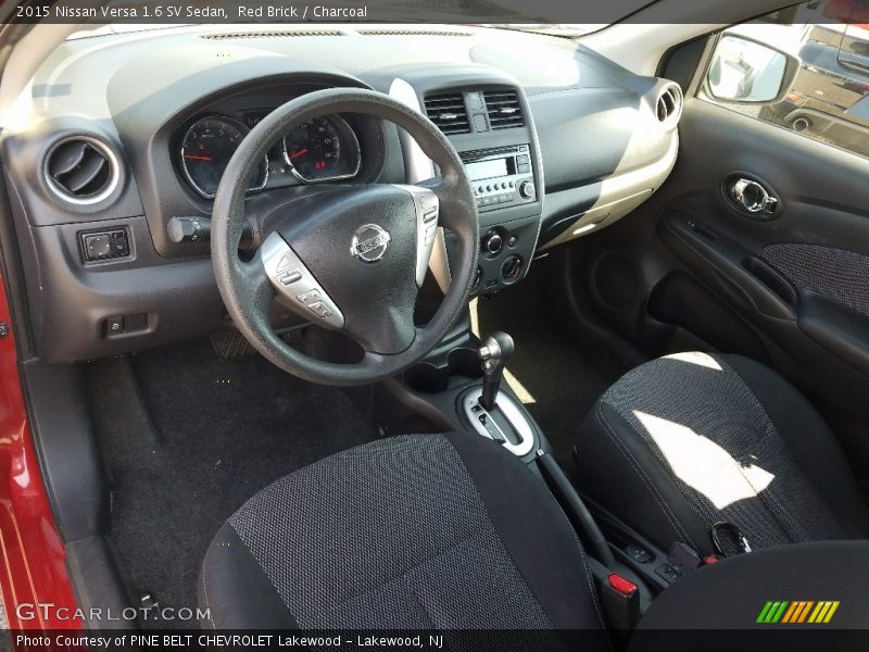 Red Brick / Charcoal 2015 Nissan Versa 1.6 SV Sedan