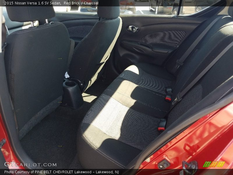 Red Brick / Charcoal 2015 Nissan Versa 1.6 SV Sedan