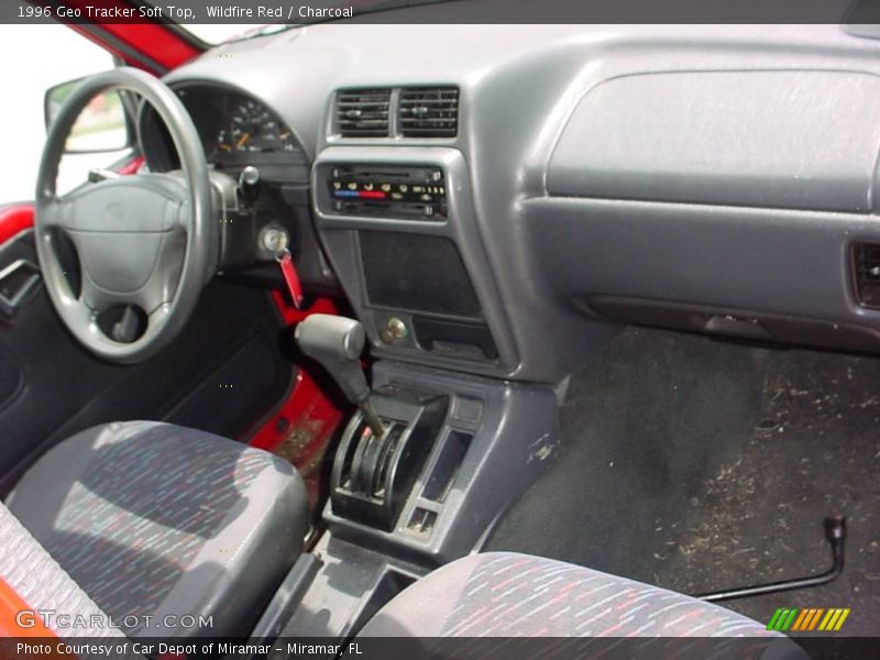 Wildfire Red / Charcoal 1996 Geo Tracker Soft Top