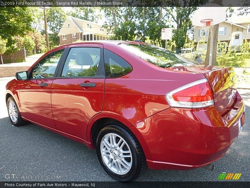 Sangria Red Metallic / Medium Stone 2009 Ford Focus SE Sedan