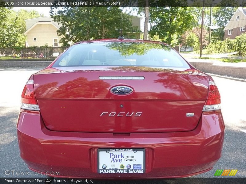 Sangria Red Metallic / Medium Stone 2009 Ford Focus SE Sedan