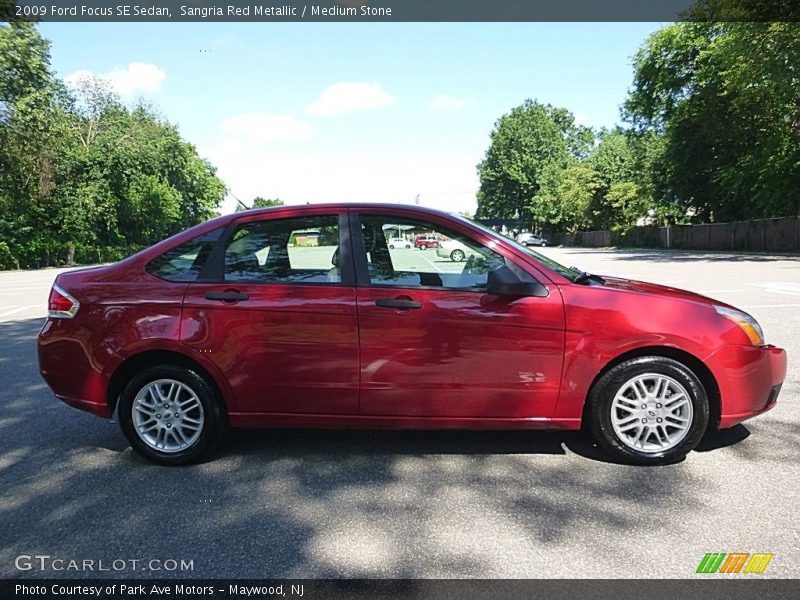 Sangria Red Metallic / Medium Stone 2009 Ford Focus SE Sedan