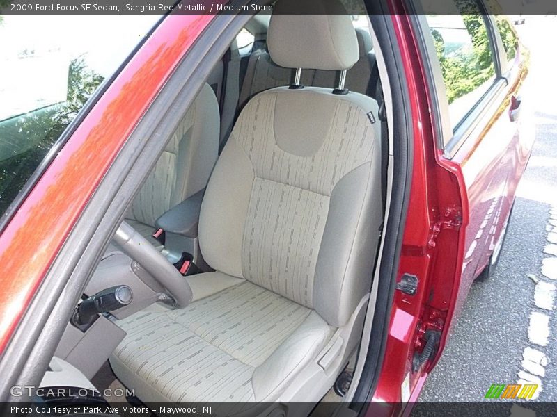 Sangria Red Metallic / Medium Stone 2009 Ford Focus SE Sedan