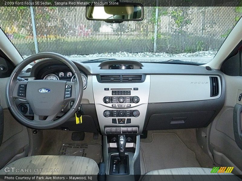 Sangria Red Metallic / Medium Stone 2009 Ford Focus SE Sedan