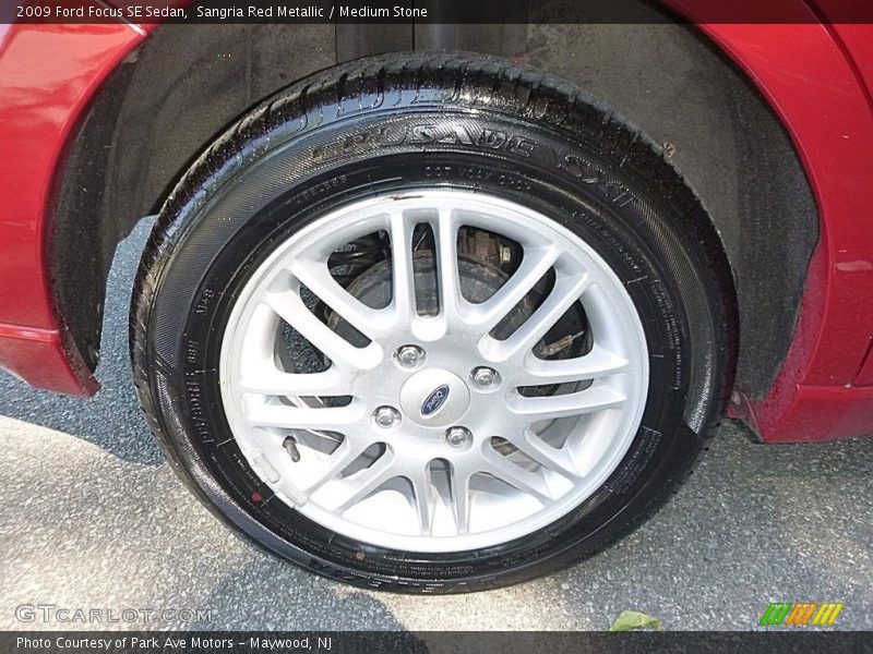 Sangria Red Metallic / Medium Stone 2009 Ford Focus SE Sedan