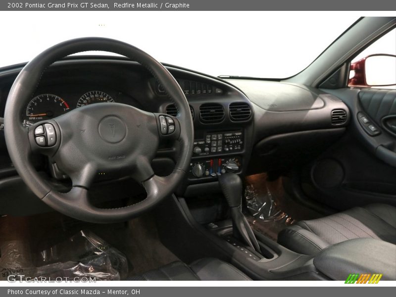 Redfire Metallic / Graphite 2002 Pontiac Grand Prix GT Sedan