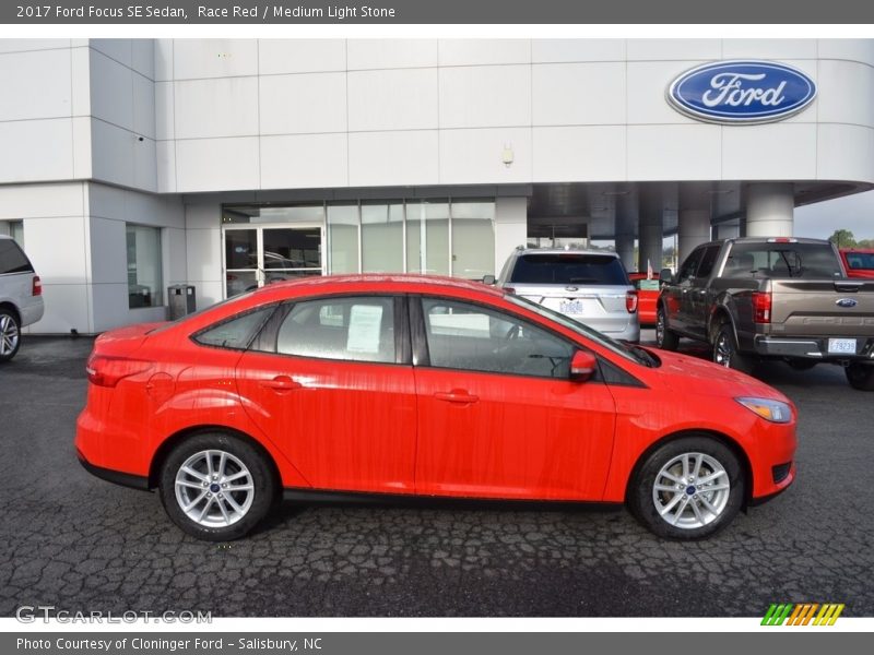 Race Red / Medium Light Stone 2017 Ford Focus SE Sedan