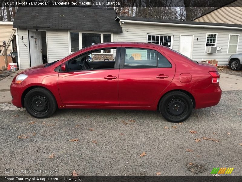 Barcelona Red Metallic / Dark Charcoal 2010 Toyota Yaris Sedan