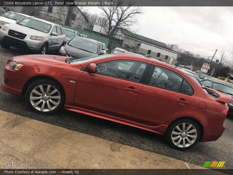 Rotor Glow Orange Metallic / Black 2009 Mitsubishi Lancer GTS