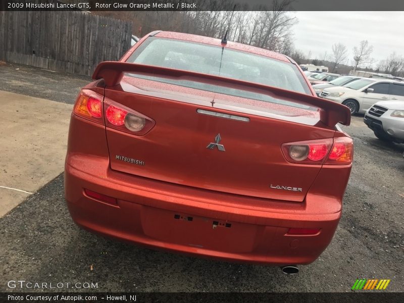 Rotor Glow Orange Metallic / Black 2009 Mitsubishi Lancer GTS