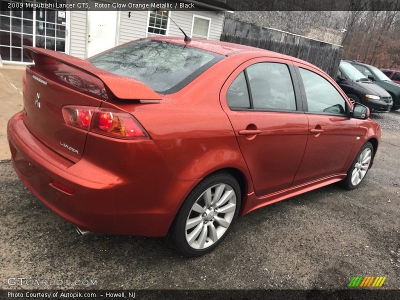 Rotor Glow Orange Metallic / Black 2009 Mitsubishi Lancer GTS