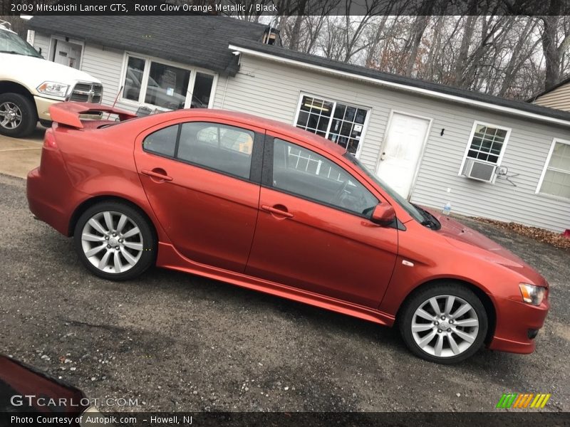 Rotor Glow Orange Metallic / Black 2009 Mitsubishi Lancer GTS
