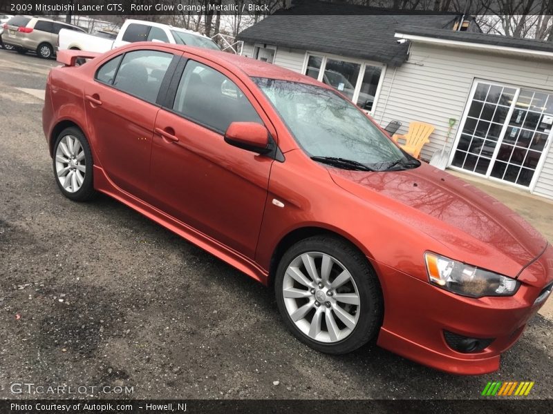 Rotor Glow Orange Metallic / Black 2009 Mitsubishi Lancer GTS