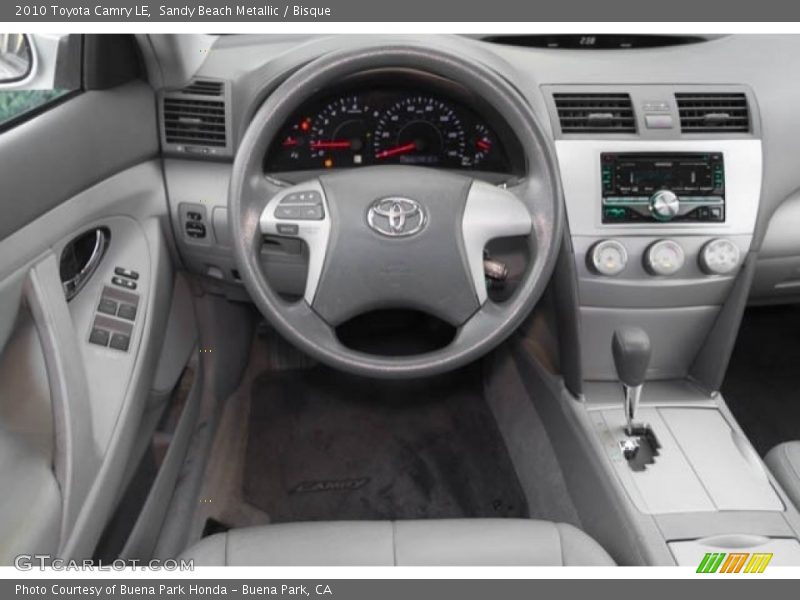 Sandy Beach Metallic / Bisque 2010 Toyota Camry LE