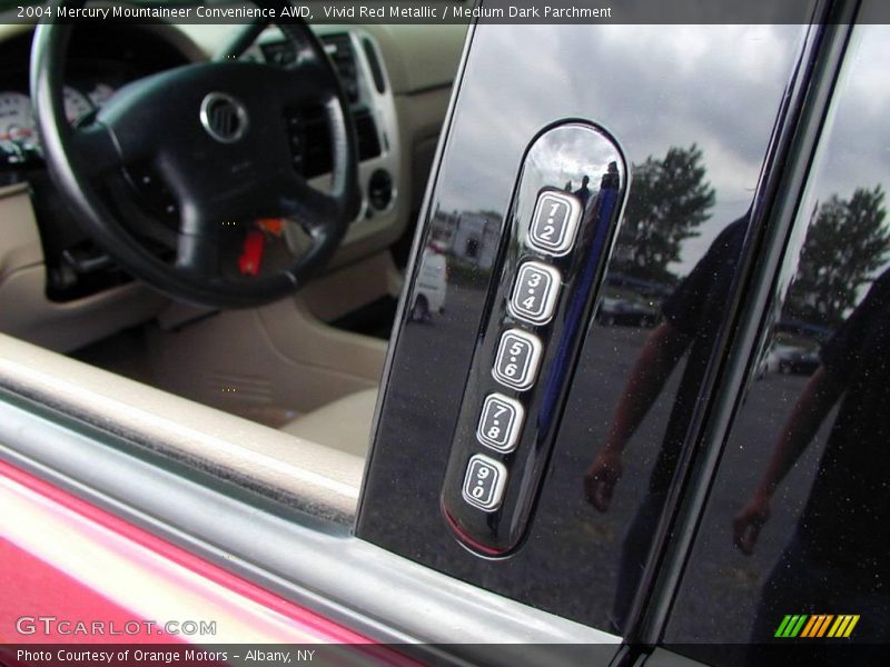 Vivid Red Metallic / Medium Dark Parchment 2004 Mercury Mountaineer Convenience AWD