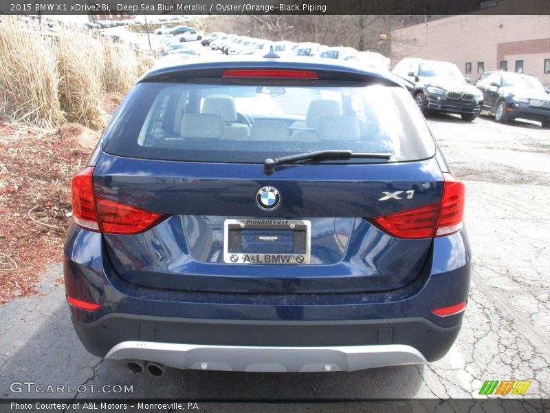 Deep Sea Blue Metallic / Oyster/Orange-Black Piping 2015 BMW X1 xDrive28i