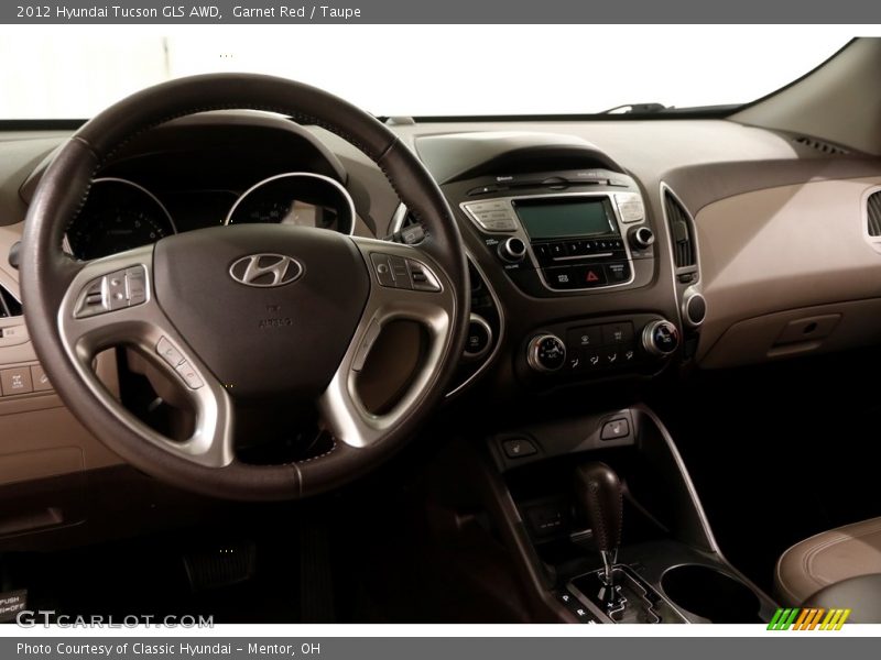 Garnet Red / Taupe 2012 Hyundai Tucson GLS AWD