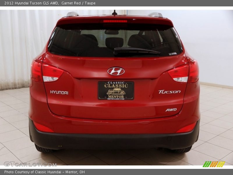 Garnet Red / Taupe 2012 Hyundai Tucson GLS AWD