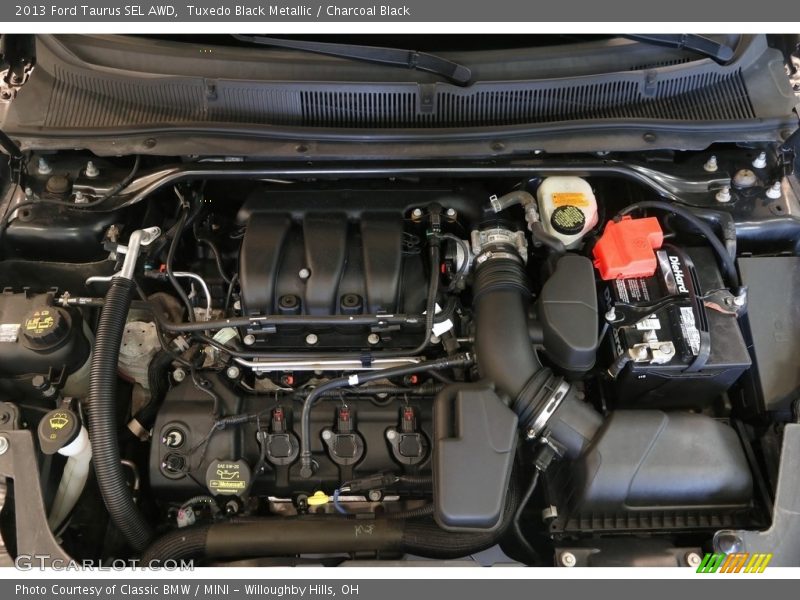 Tuxedo Black Metallic / Charcoal Black 2013 Ford Taurus SEL AWD