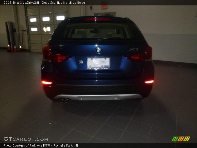 Deep Sea Blue Metallic / Beige 2015 BMW X1 xDrive28i