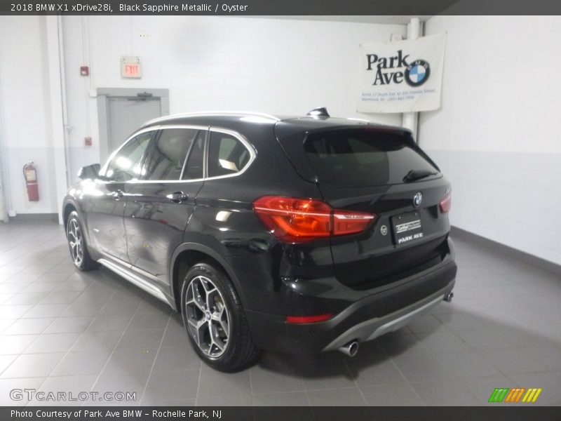 Black Sapphire Metallic / Oyster 2018 BMW X1 xDrive28i