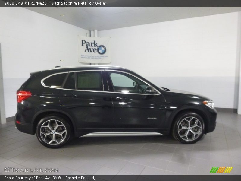 Black Sapphire Metallic / Oyster 2018 BMW X1 xDrive28i