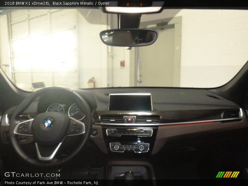 Black Sapphire Metallic / Oyster 2018 BMW X1 xDrive28i