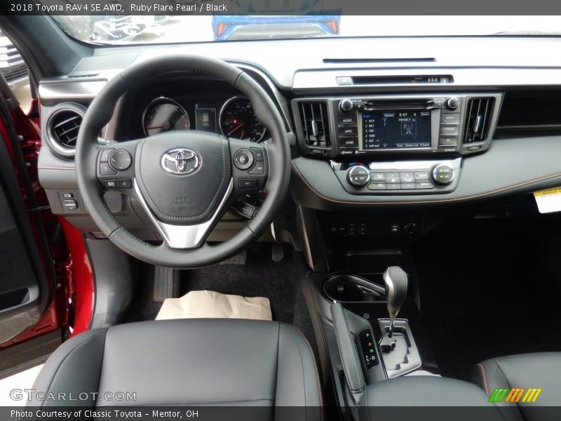 Ruby Flare Pearl / Black 2018 Toyota RAV4 SE AWD