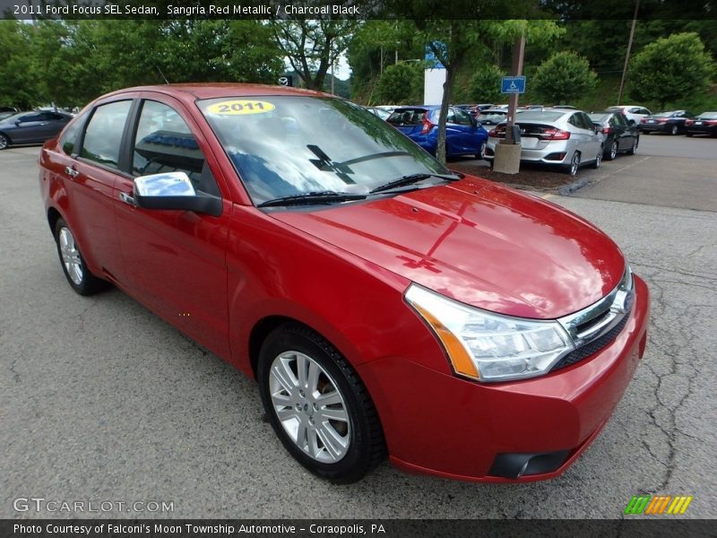 Sangria Red Metallic / Charcoal Black 2011 Ford Focus SEL Sedan
