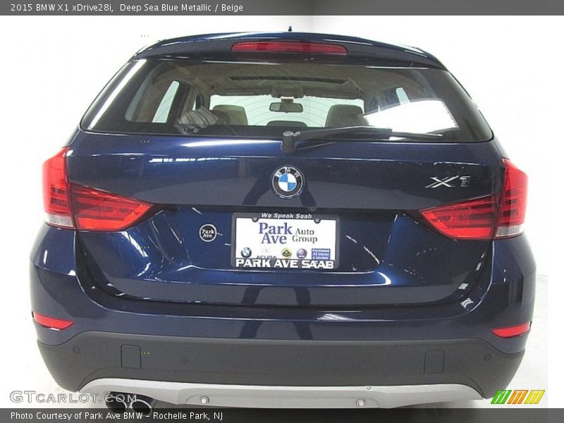 Deep Sea Blue Metallic / Beige 2015 BMW X1 xDrive28i