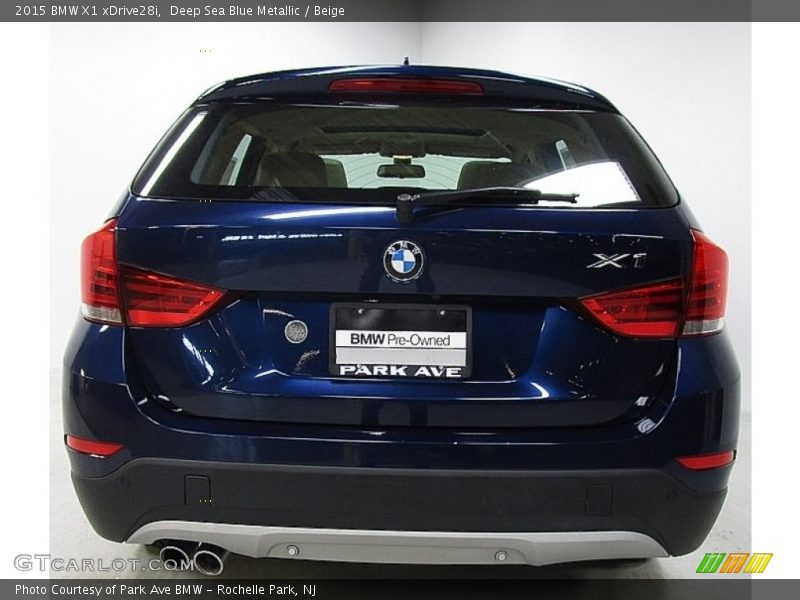Deep Sea Blue Metallic / Beige 2015 BMW X1 xDrive28i