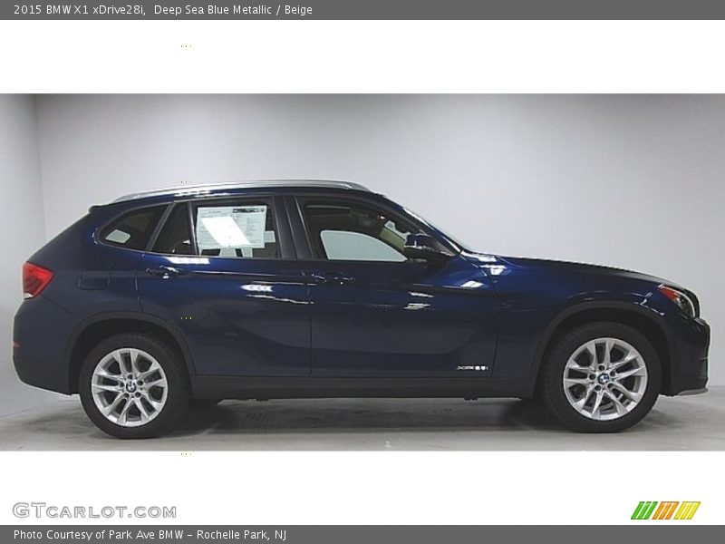 Deep Sea Blue Metallic / Beige 2015 BMW X1 xDrive28i
