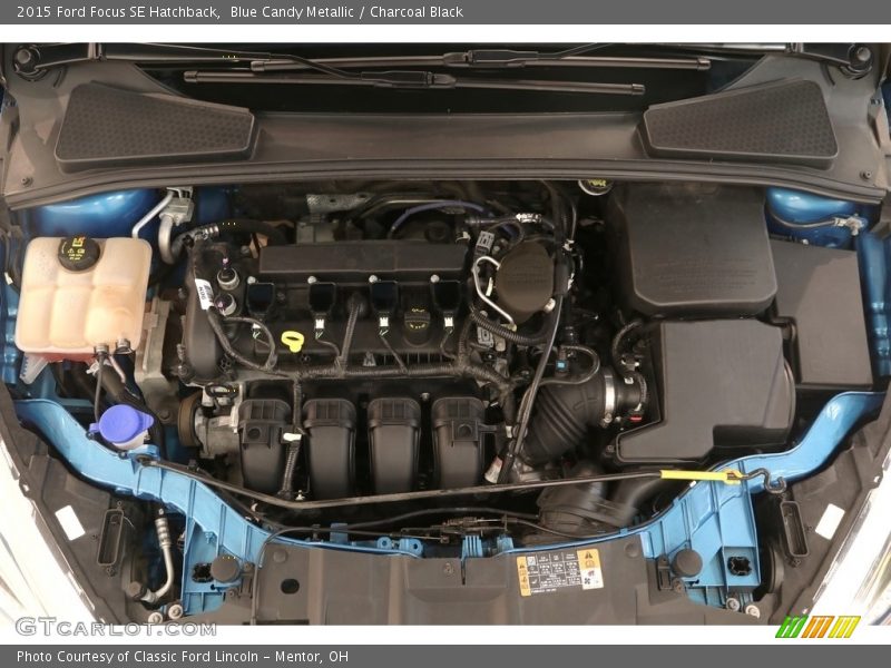 Blue Candy Metallic / Charcoal Black 2015 Ford Focus SE Hatchback