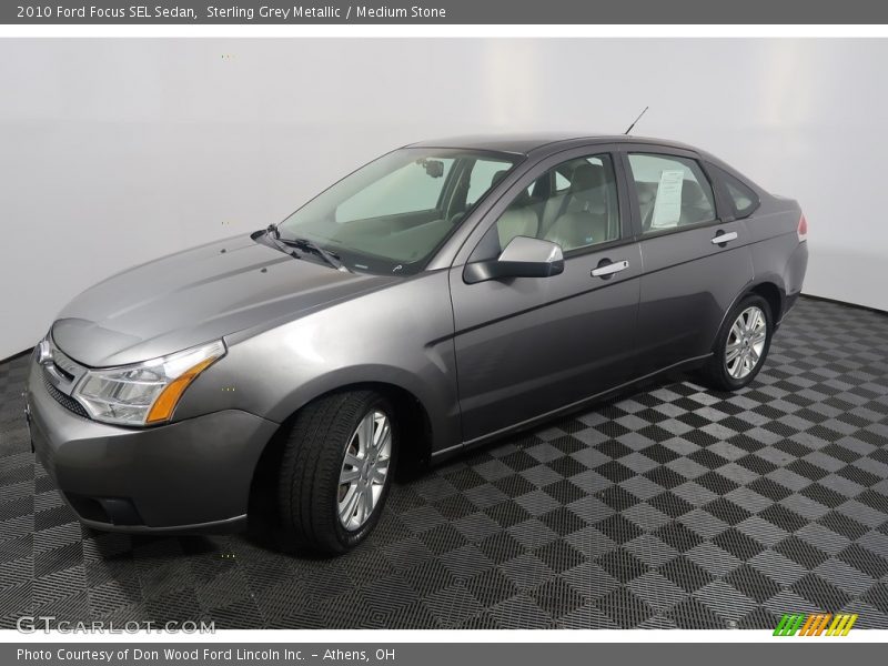 Sterling Grey Metallic / Medium Stone 2010 Ford Focus SEL Sedan